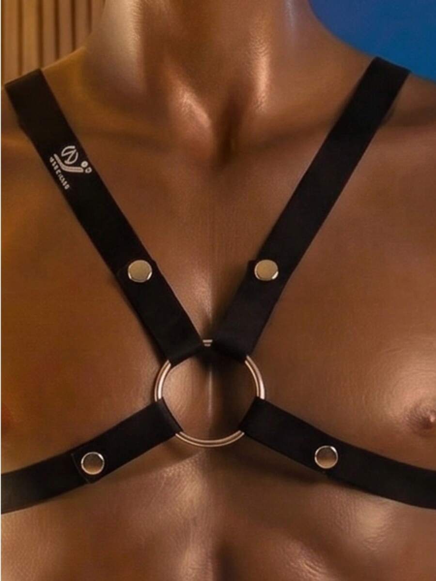 Men's black criss cross sexy vest top featuring metal decor and medium stretch fabric.