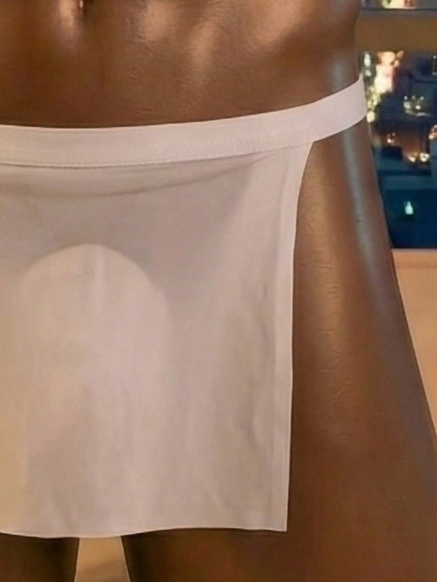 Front view of a men's black low rise thong underwear made from stretch fabric.