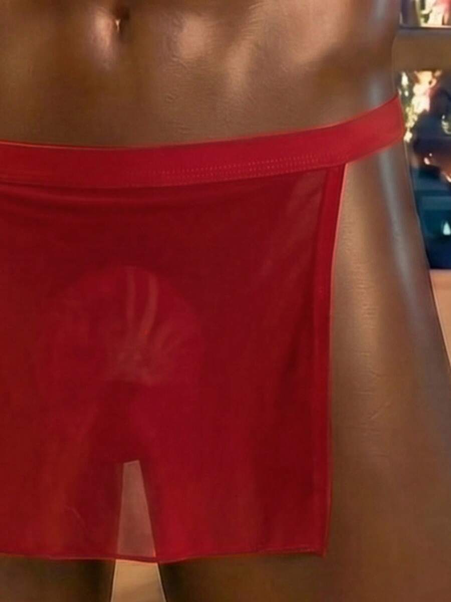 Front view of a men's black low rise thong underwear made from stretch fabric.