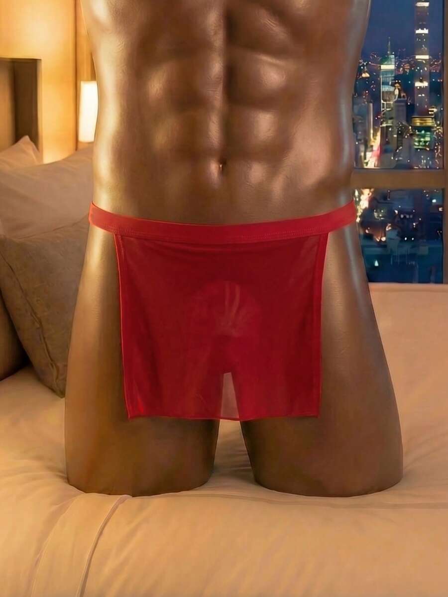 Front view of a men's black low rise thong underwear made from stretch fabric.