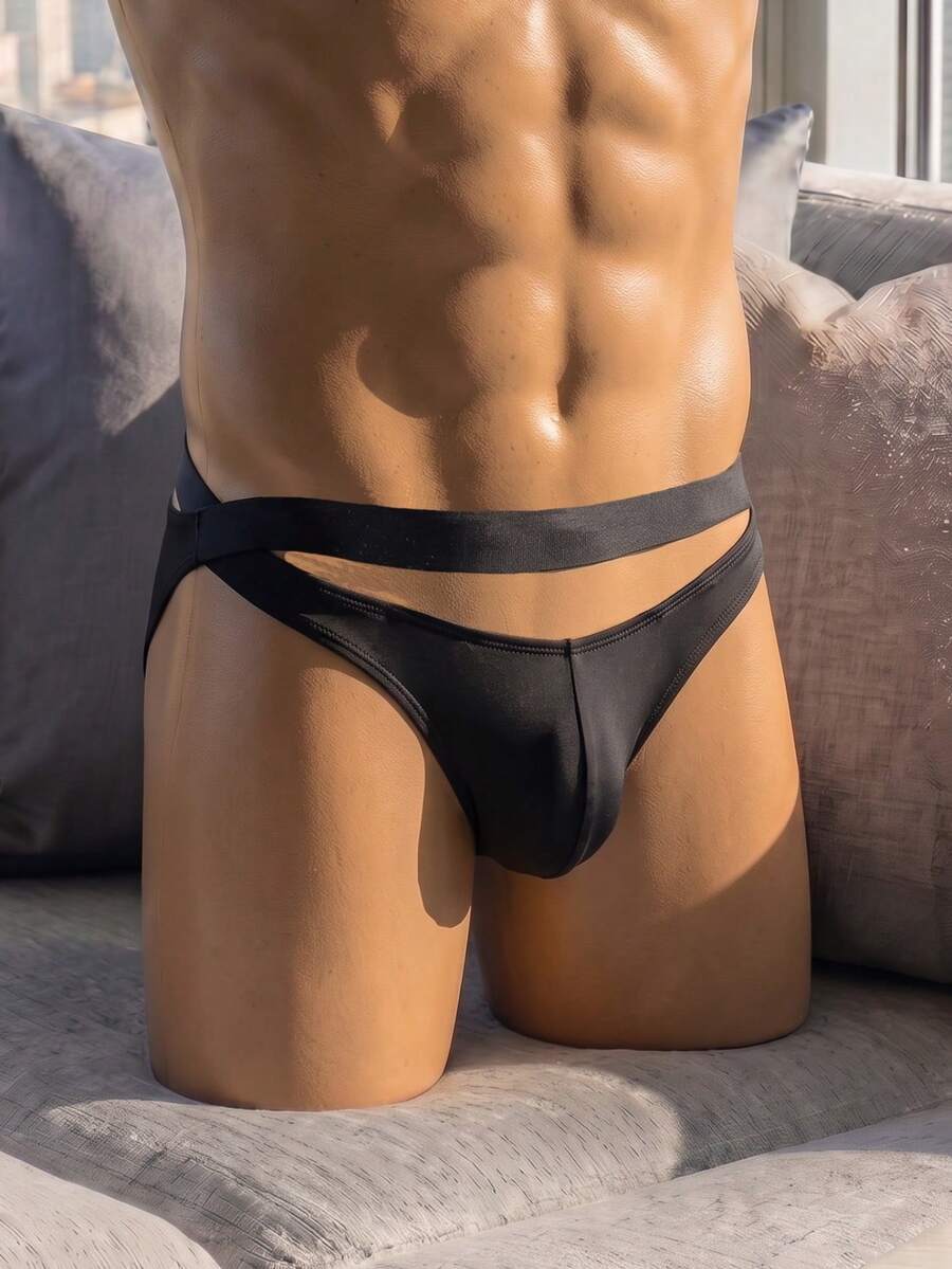 Front view of solid black low rise men's briefs underwear made from stretch knitted fabric.