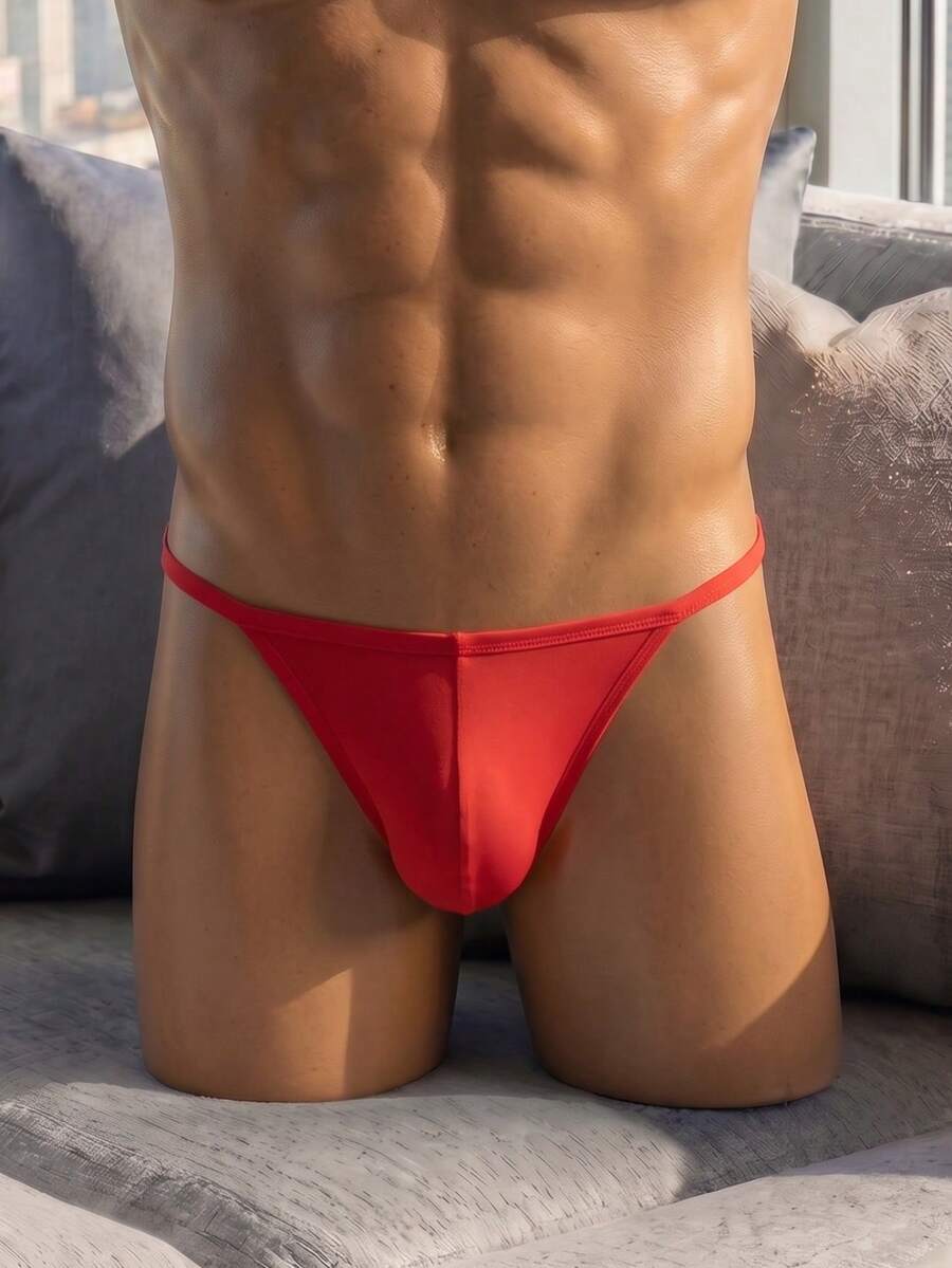 Men's red low rise colorblock jockstrap underwear made from medium stretch knitted fabric.