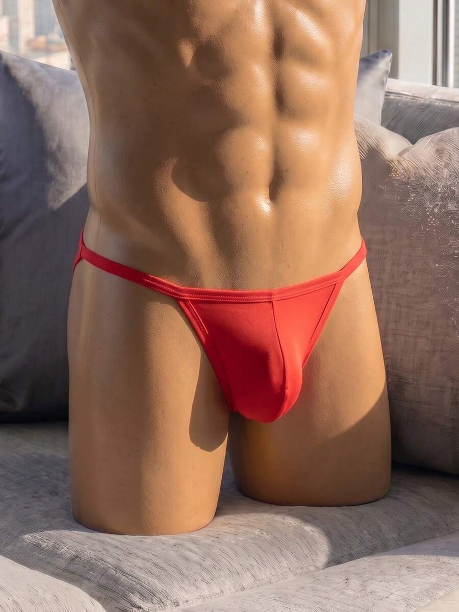 Men's red low rise colorblock jockstrap underwear made from medium stretch knitted fabric.