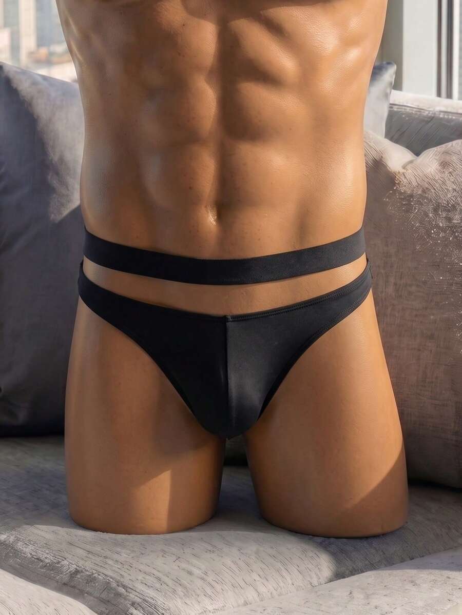 Front view of solid black low rise men's briefs underwear made from stretch knitted fabric.