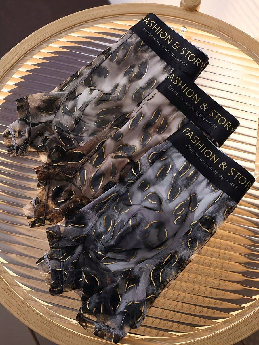 Pack of 3 men's semi-sheer chiffon boxer briefs in mixed colors featuring a high-rise waist and high stretch fabric.