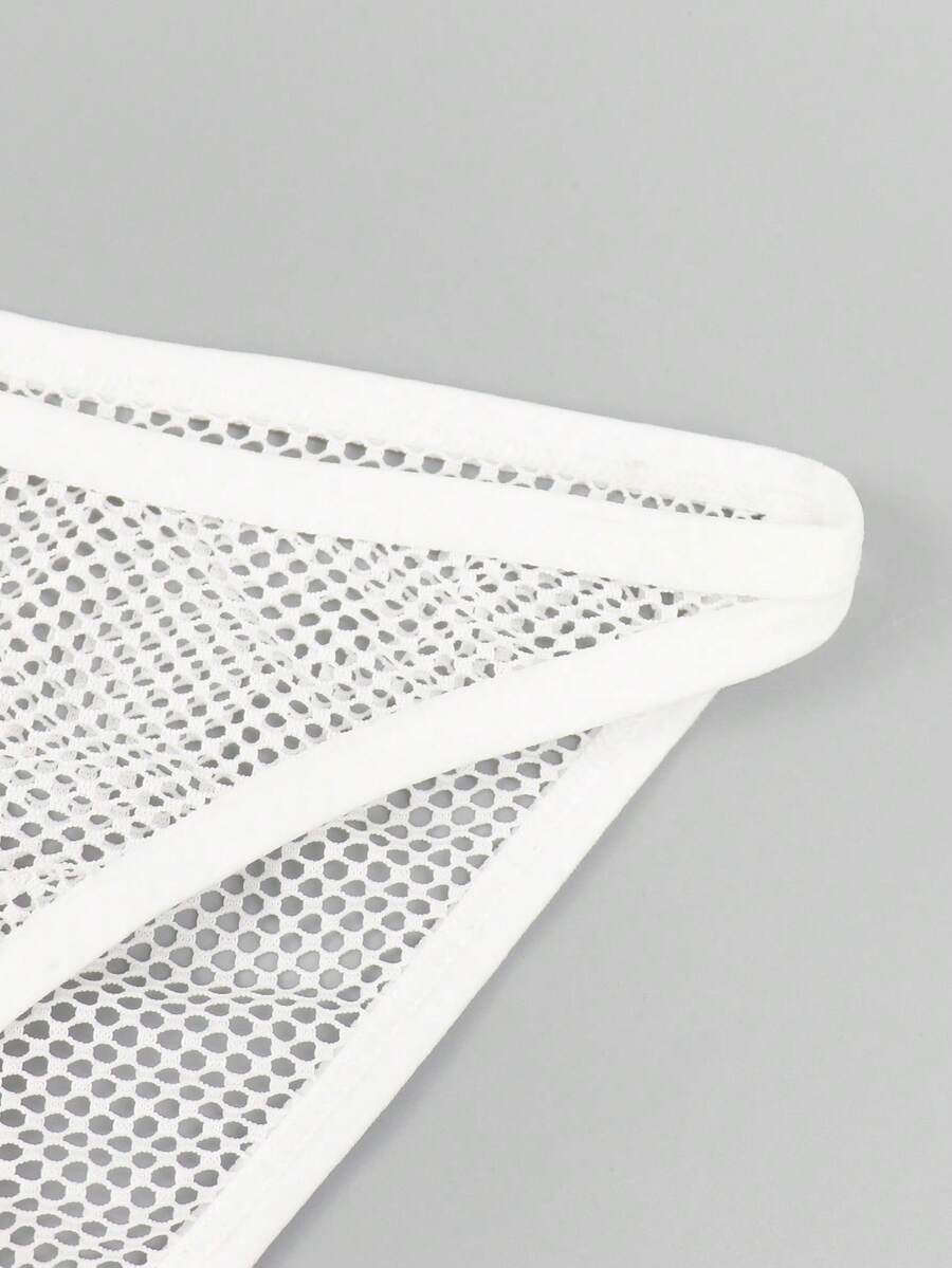 White men's low rise hollow out mesh jockstrap featuring contrast lace detailing and a scoop neck.