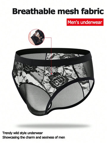 Men's black low rise sheer mesh thong with plant pattern detail.