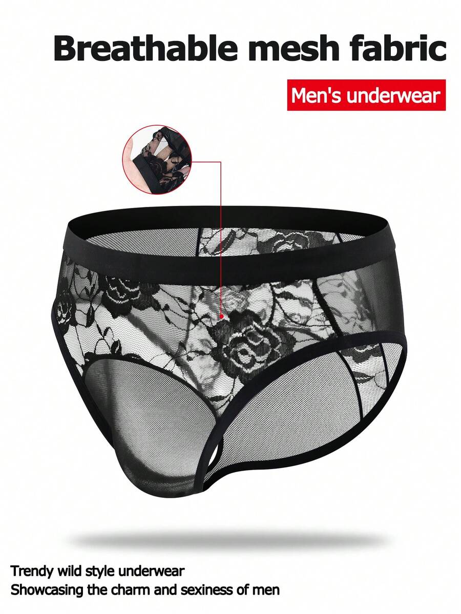 Men's black low rise sheer mesh thong with plant pattern detail.