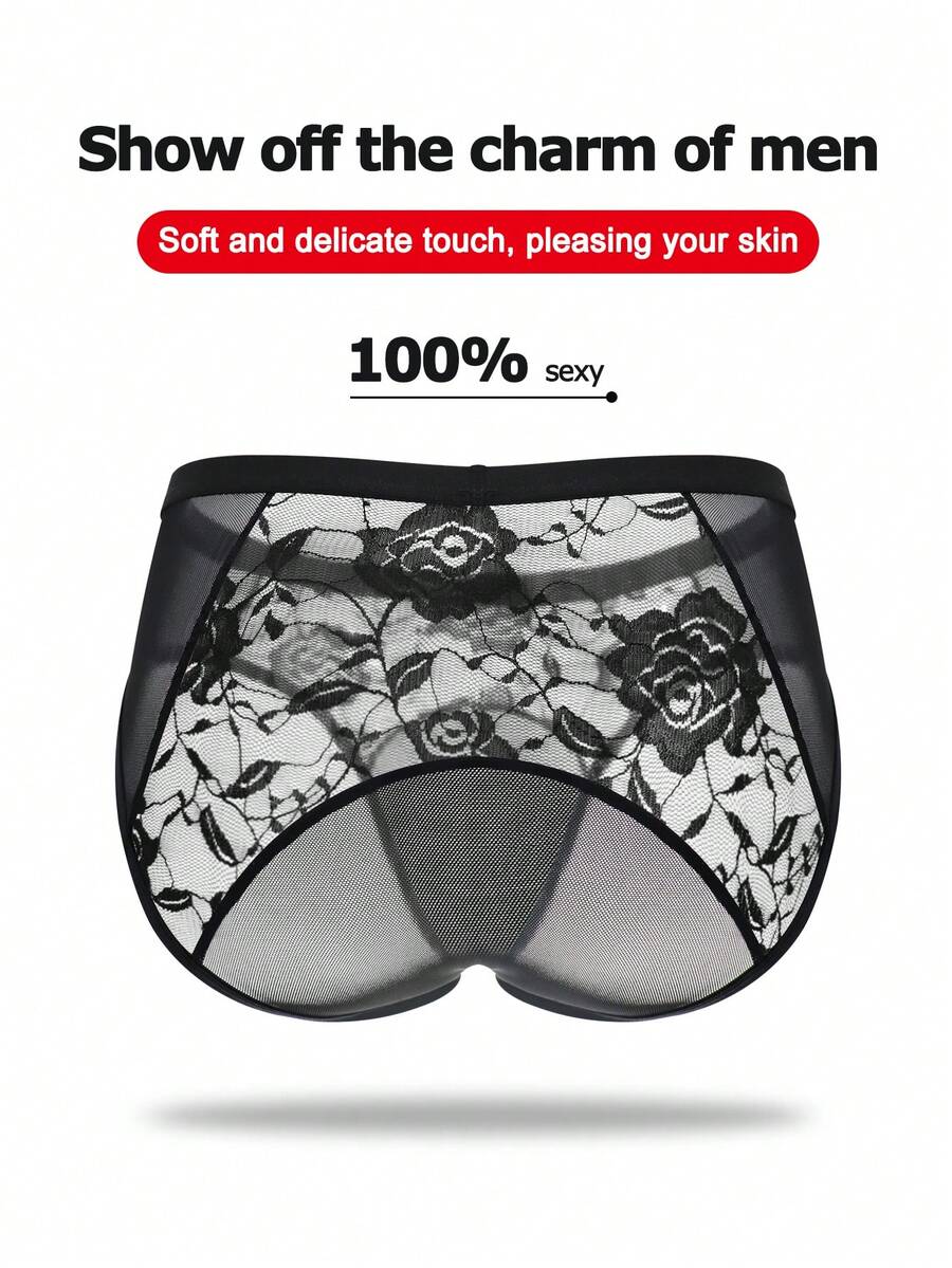 Men's black low rise sheer mesh thong with plant pattern detail.