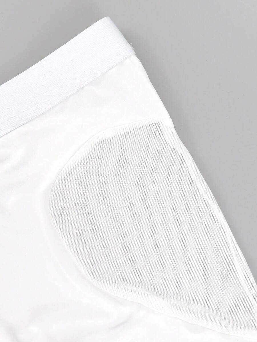 White men's low-rise mesh contrast boxer shorts featuring a plain patchwork design made of stretch fabric.