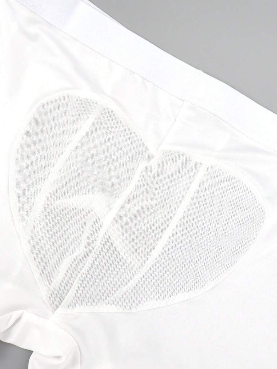 White men's low-rise mesh contrast boxer shorts featuring a plain patchwork design made of stretch fabric.