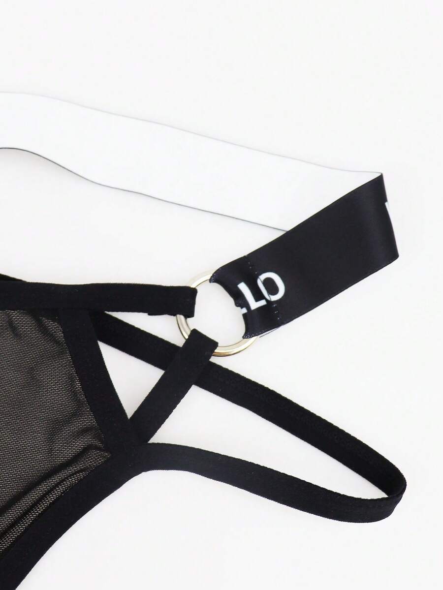 Black men's low rise mesh thong underwear featuring a backless design, sheer fabric, cup detail, and medium stretch material.