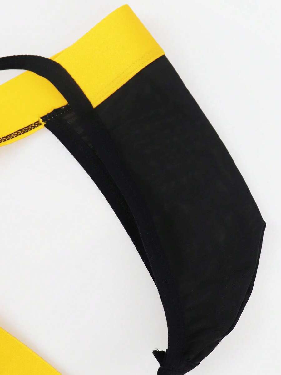 Black low rise men's thong underwear with embroidery detail on knitted fabric.