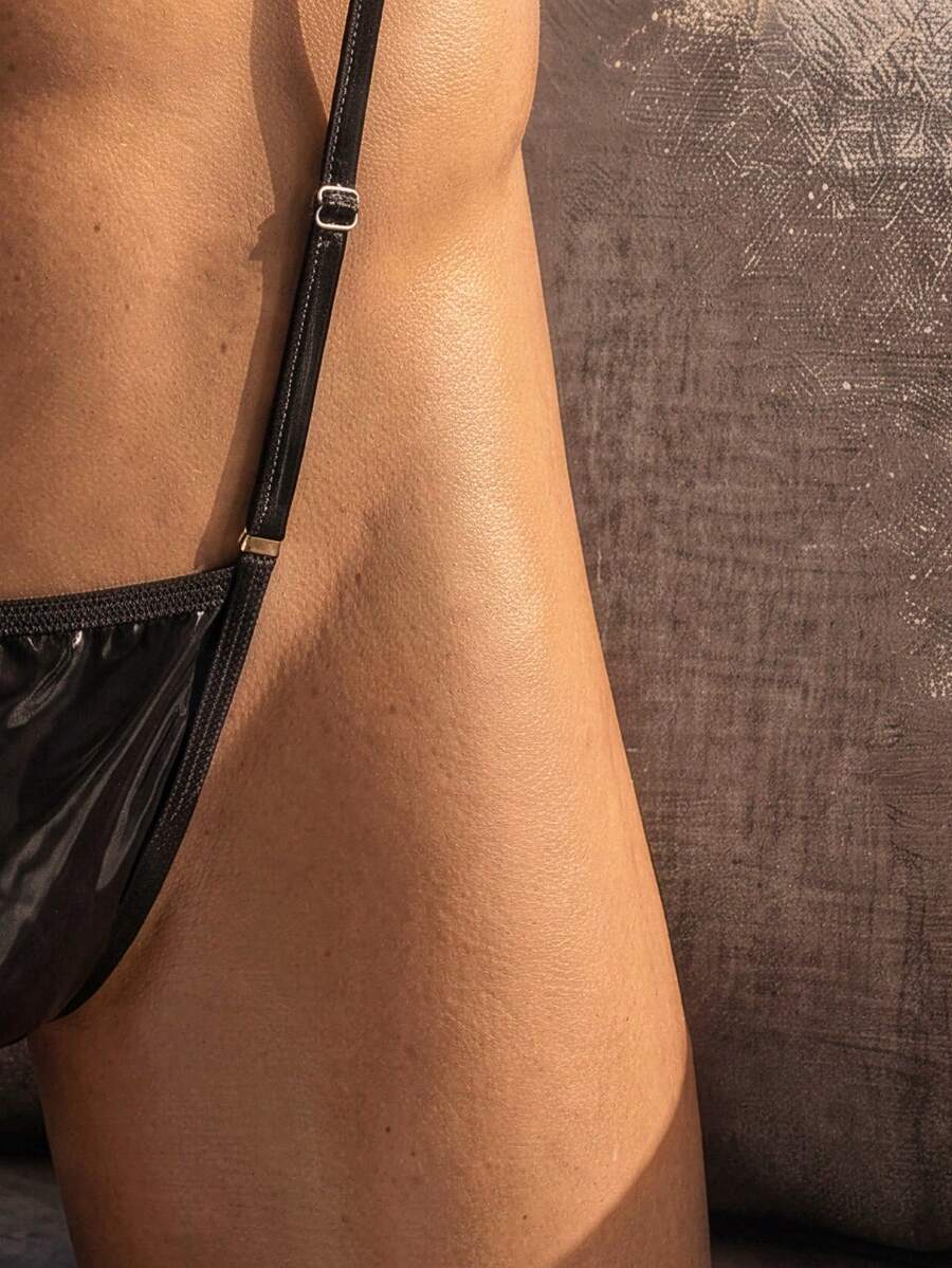 Black men's PU material sexy vest with stand collar and matching low-rise V-string underwear featuring ring detail