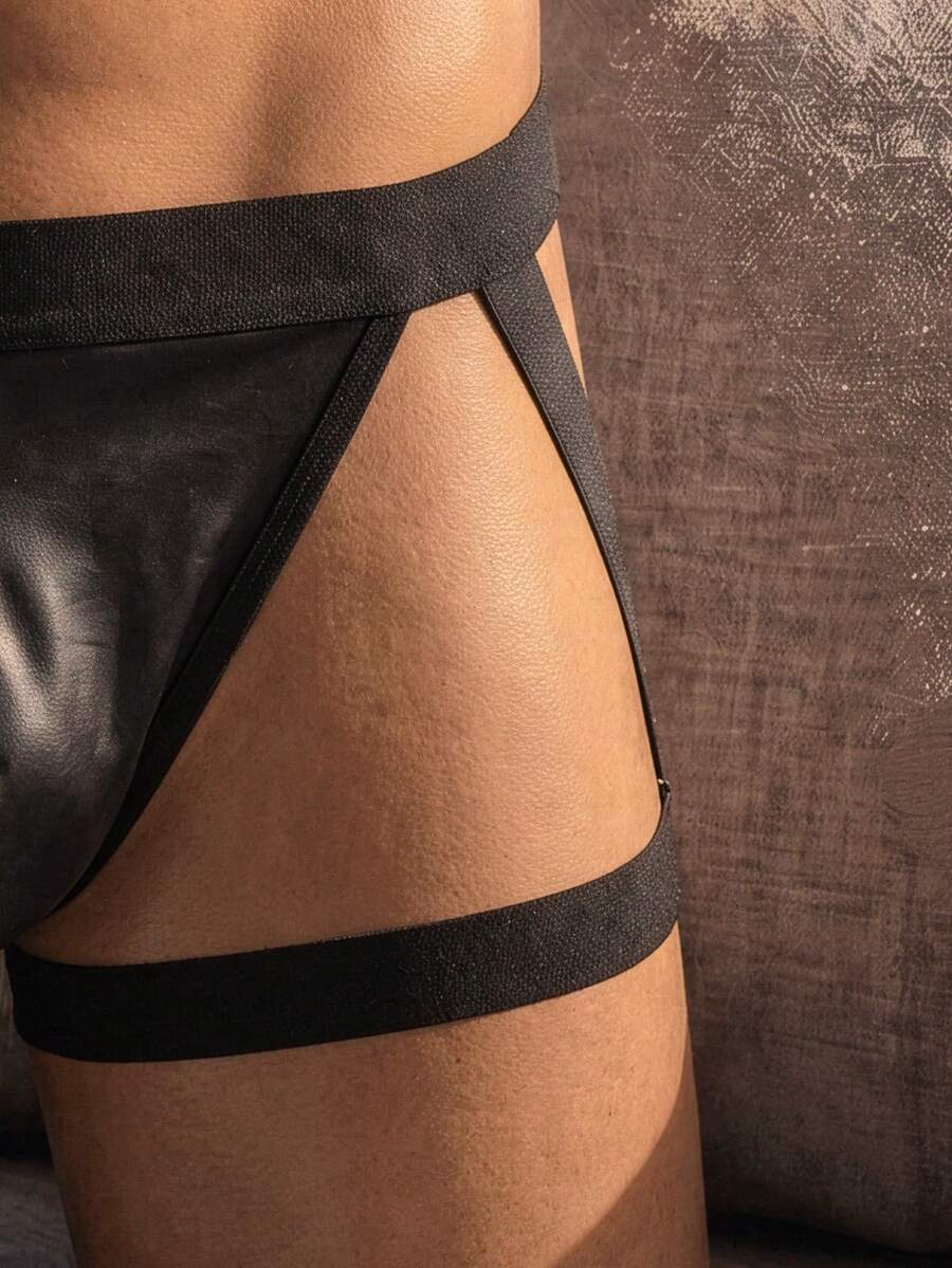 Men's low rise solid black PU boxer briefs featuring a sleek unlined design with medium stretch.