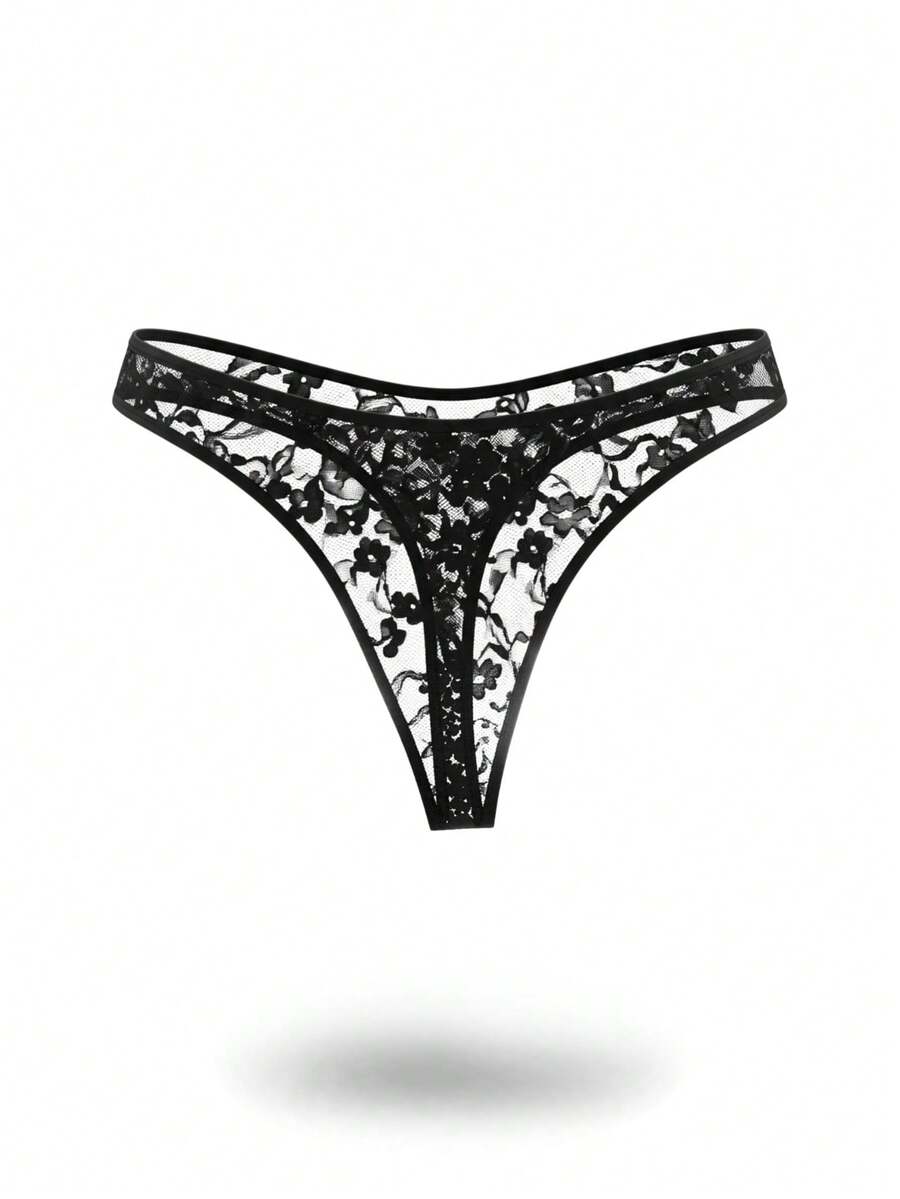 Black low rise men's lace thong underwear with hollow out plant pattern design.