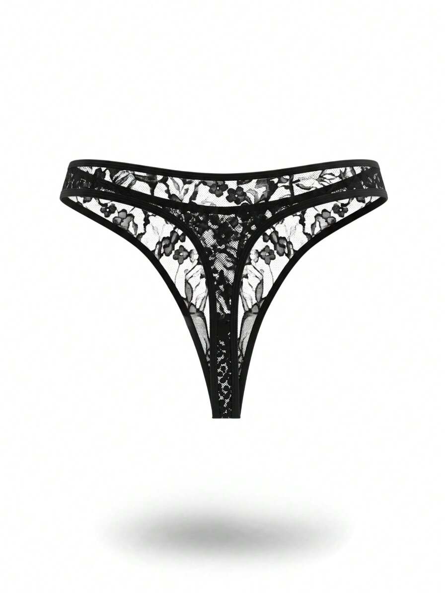 Black low rise men's lace thong underwear with hollow out plant pattern design.