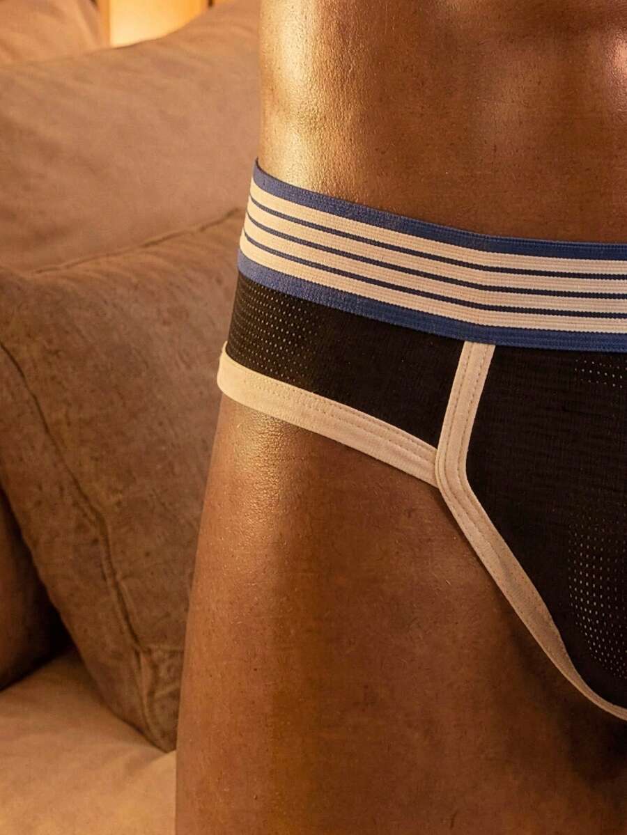 Men's low rise striped jockstrap underwear crafted from multicolor knitted stretch fabric.