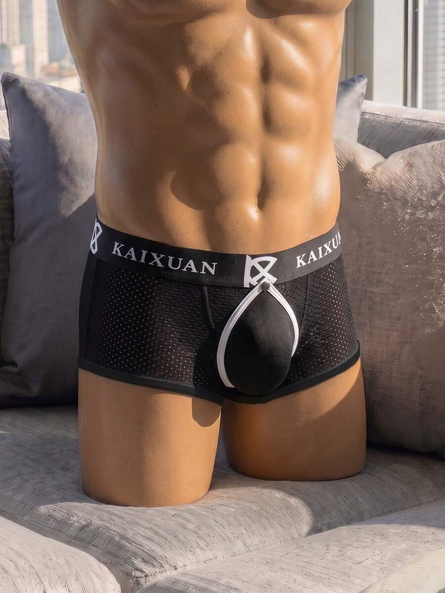Men's solid black low rise cup boxer briefs crafted from polyamide stretch fabric