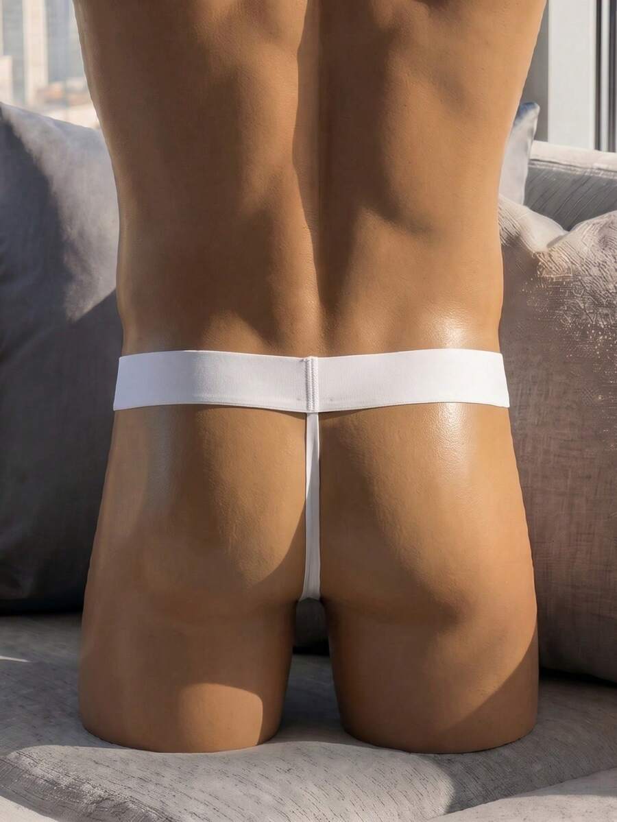 White low rise men's mesh thong underwear featuring a colorblock style.
