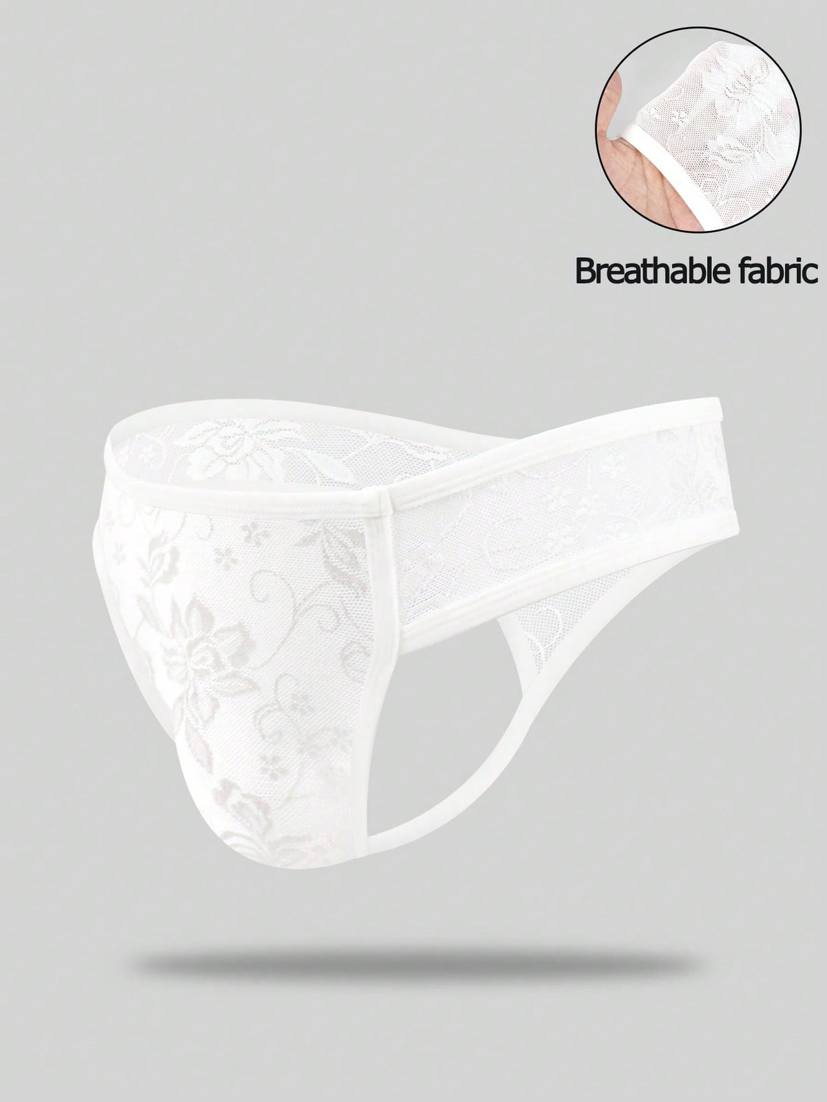White lace thong underwear for men featuring a low rise waist and plant pattern knitted fabric.