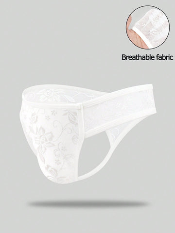 White lace thong underwear for men featuring a low rise waist and plant pattern knitted fabric.