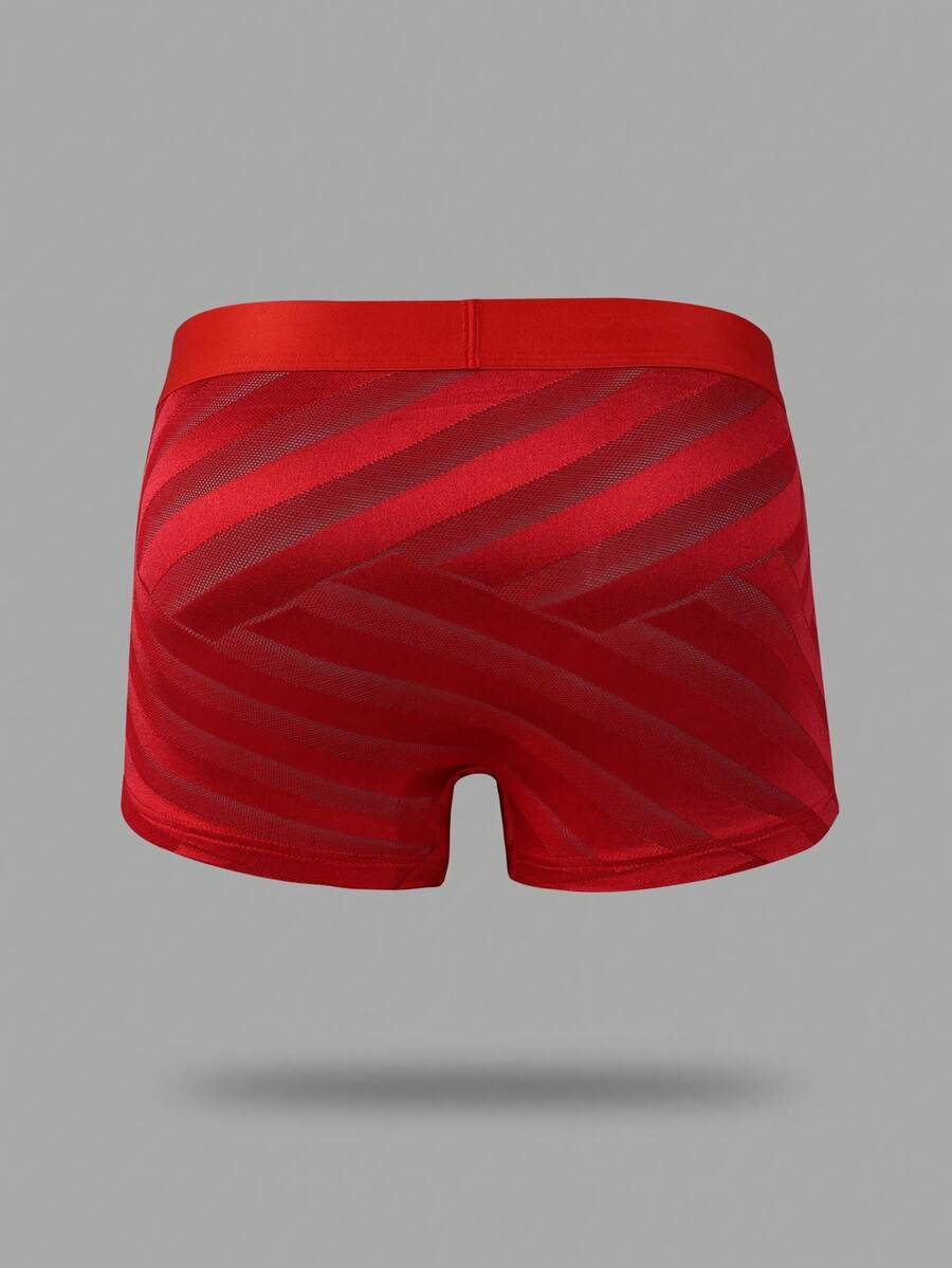 Men's plain red mid-rise boxer shorts made of stretch knitted fabric.