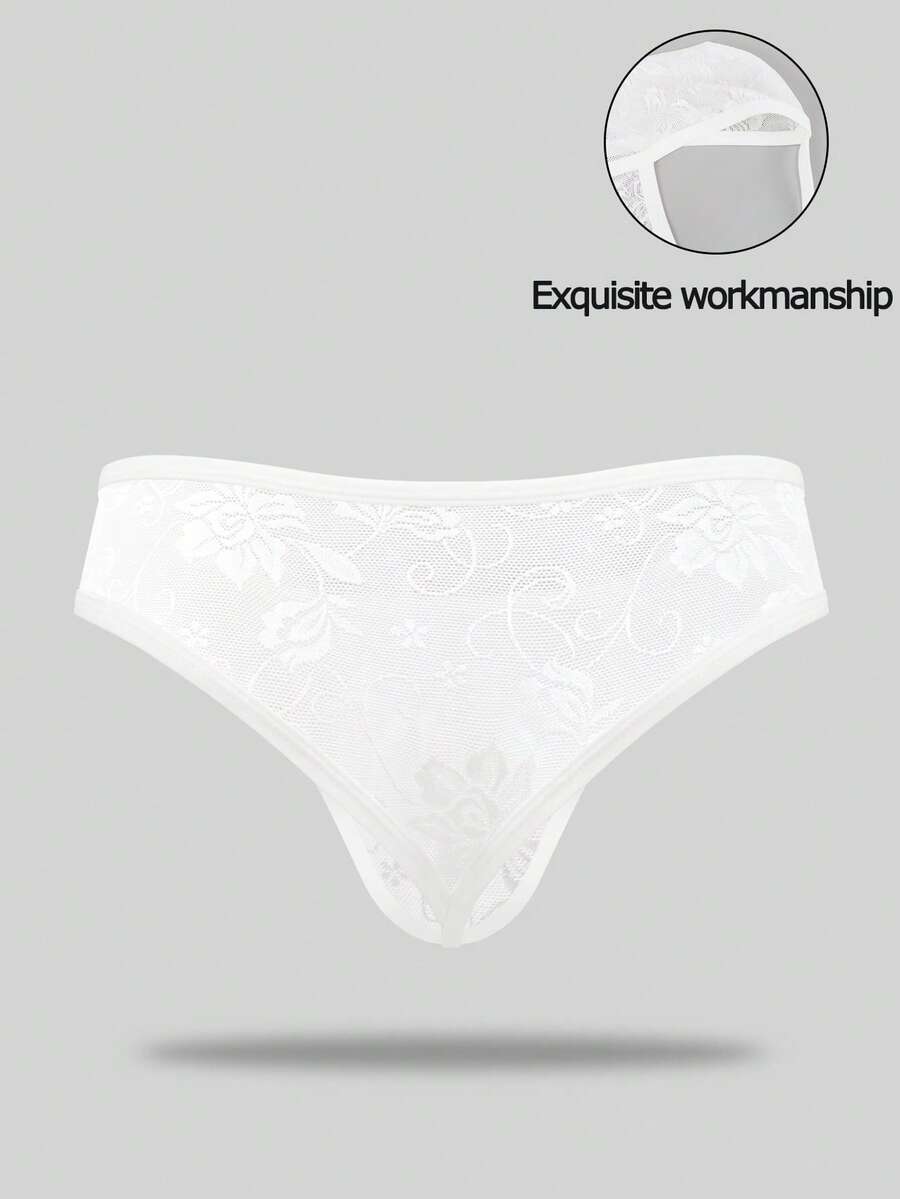 White lace thong underwear for men featuring a low rise waist and plant pattern knitted fabric.