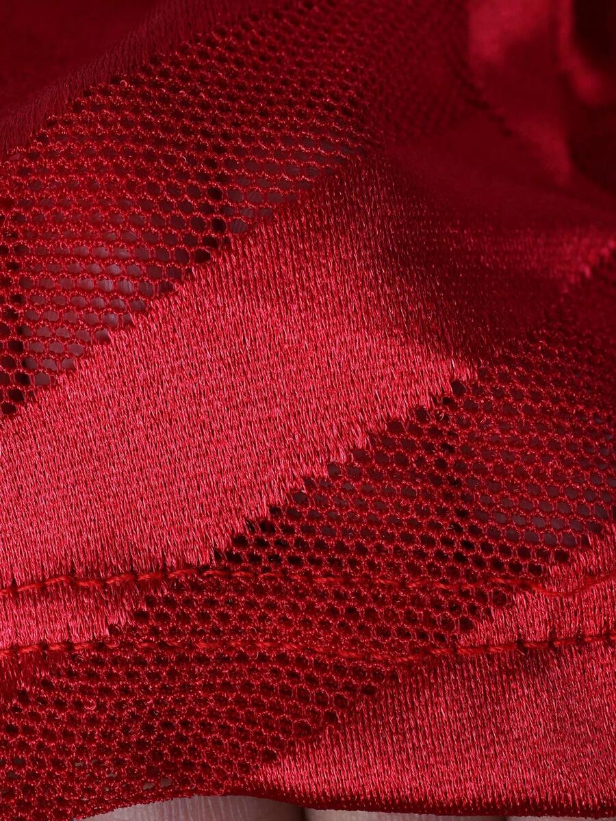 Men's plain red mid-rise boxer shorts made of stretch knitted fabric.