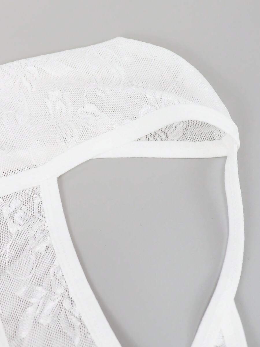 White lace thong underwear for men featuring a low rise waist and plant pattern knitted fabric.