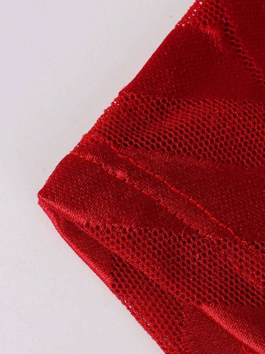 Men's plain red mid-rise boxer shorts made of stretch knitted fabric.