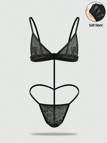 Men's black mesh thong underwear featuring a low-rise fit and backless design.