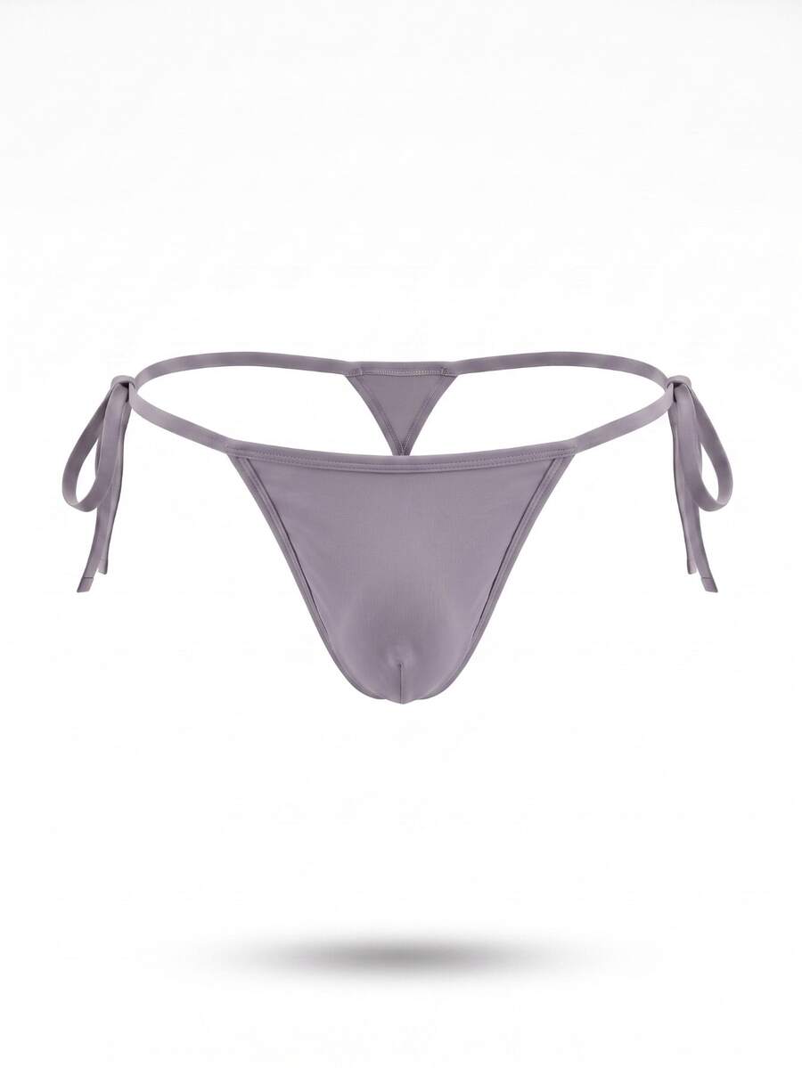 Men's black knitted fabric low-rise thong underwear featuring knot detail.
