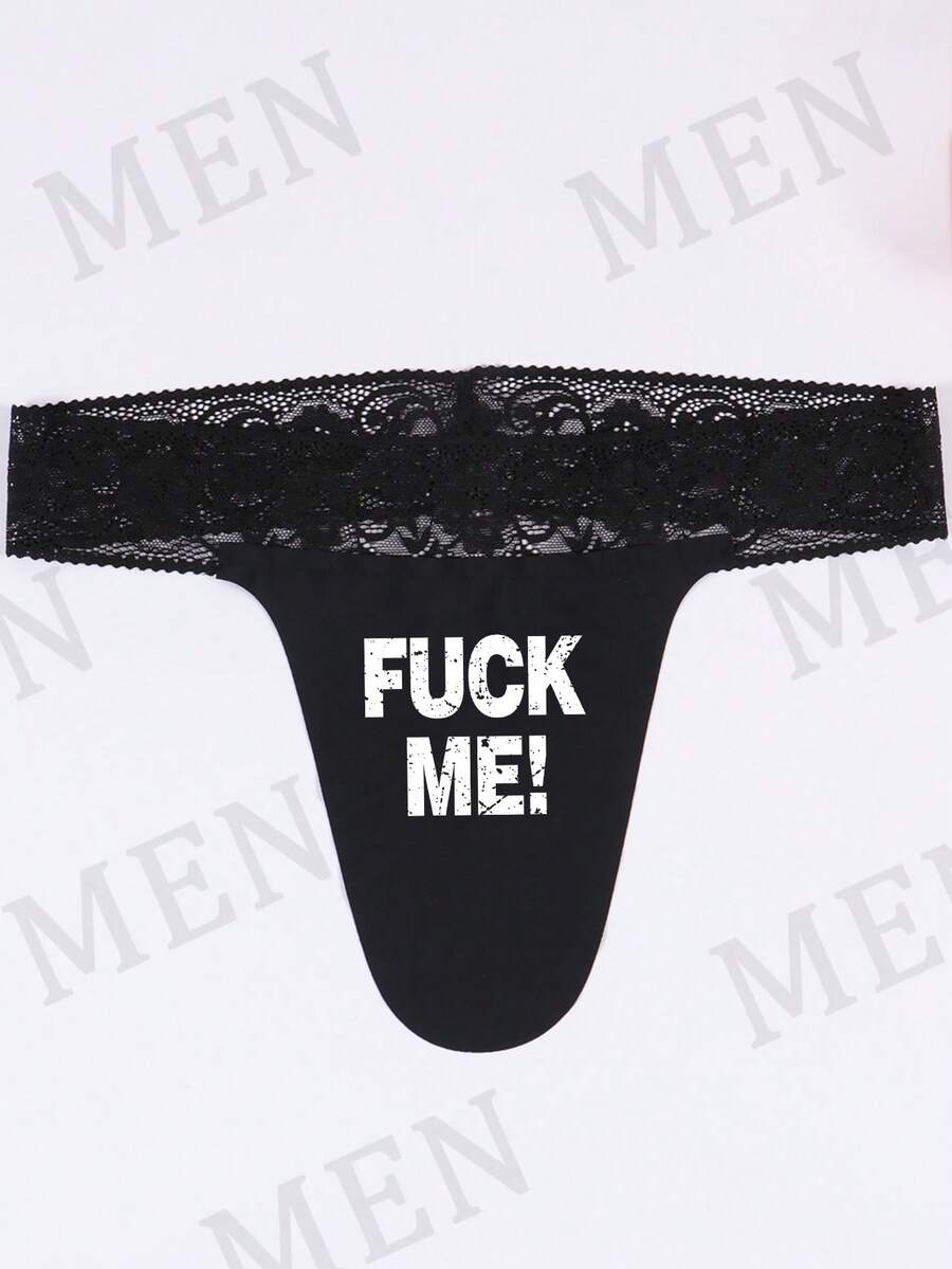 Black men's low rise thong underwear featuring a letter printed waistband and tape details.