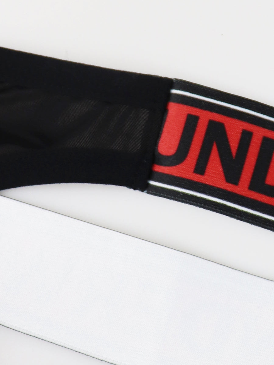 Black low rise men's thong underwear crafted from solid knitted stretch fabric.