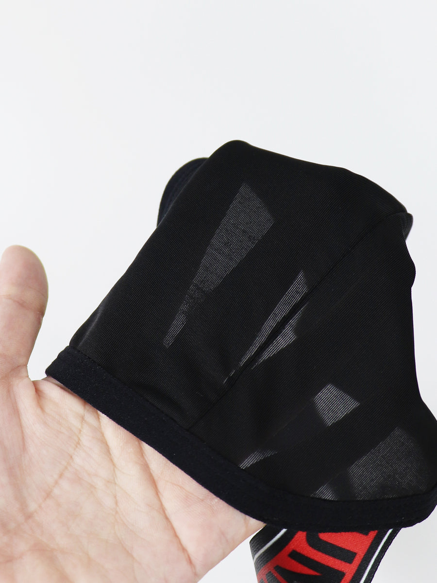 Black low rise men's thong underwear crafted from solid knitted stretch fabric.