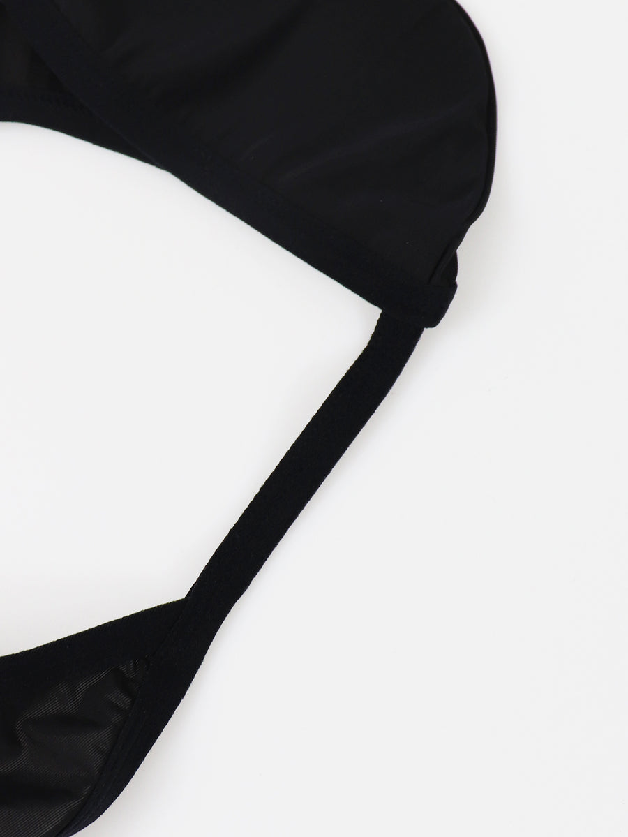Black low rise men's thong underwear crafted from solid knitted stretch fabric.