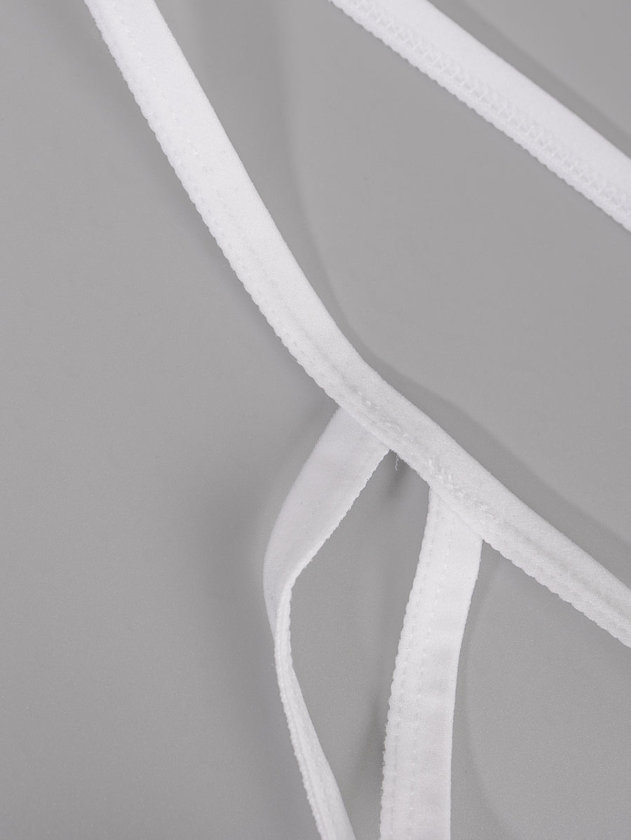 Men's solid white low-rise thong underwear featuring a U-convex contour pouch design.