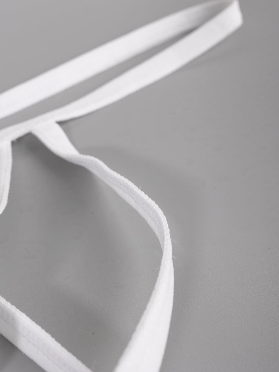Men's solid white low-rise thong underwear featuring a U-convex contour pouch design.