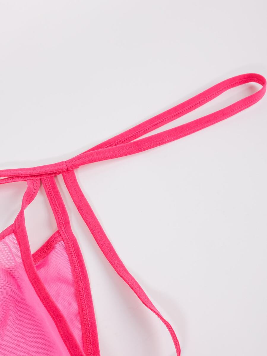 Hot pink men's low-rise mesh thong underwear featuring a colorblock pattern and breathable mesh fabric construction.