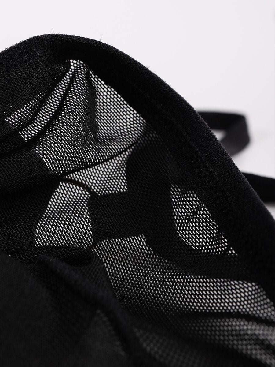 Black men's mesh thong underwear with low-rise waist and U-convex design.
