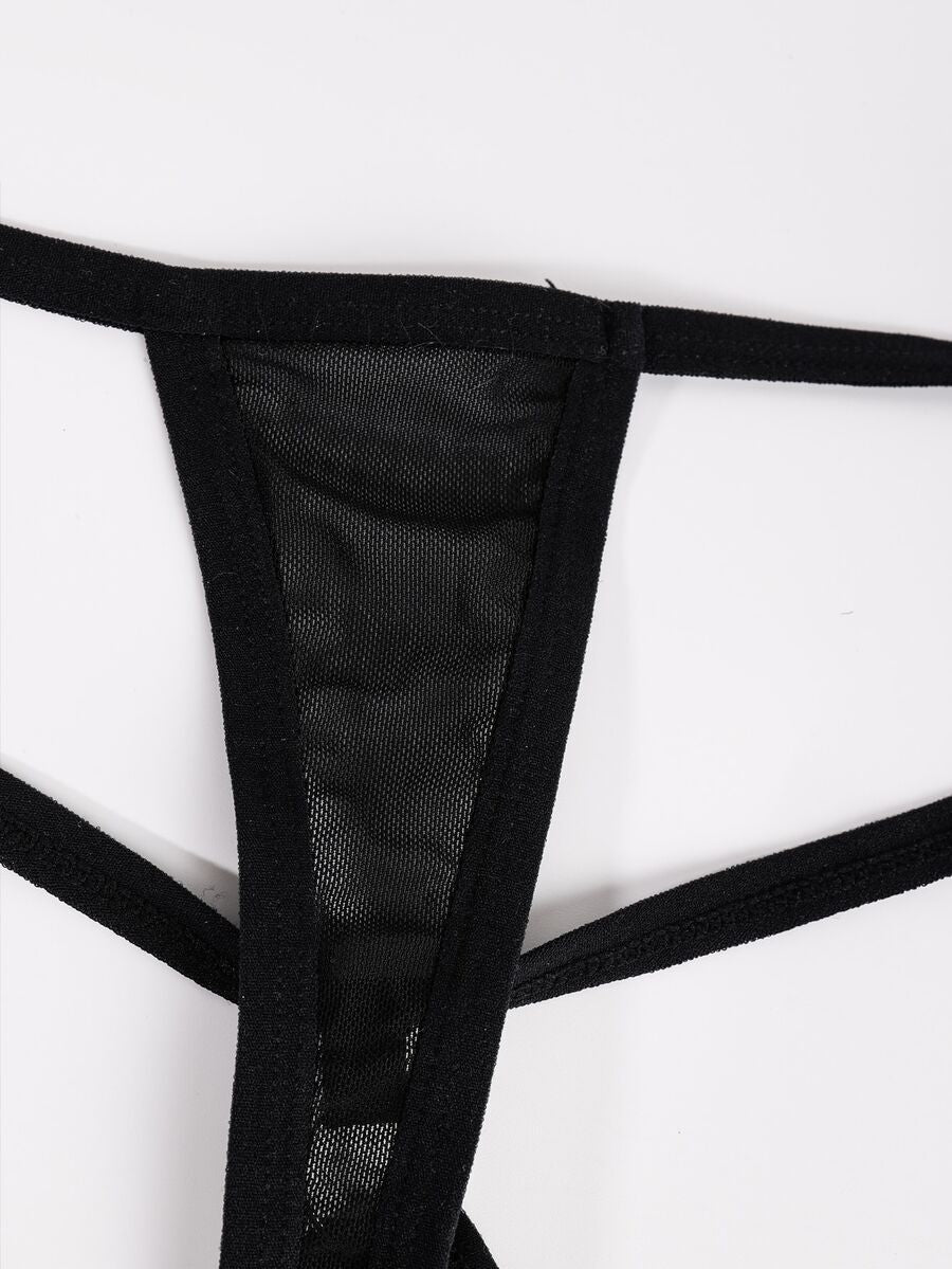 Black men's mesh thong underwear with low-rise waist and U-convex design.
