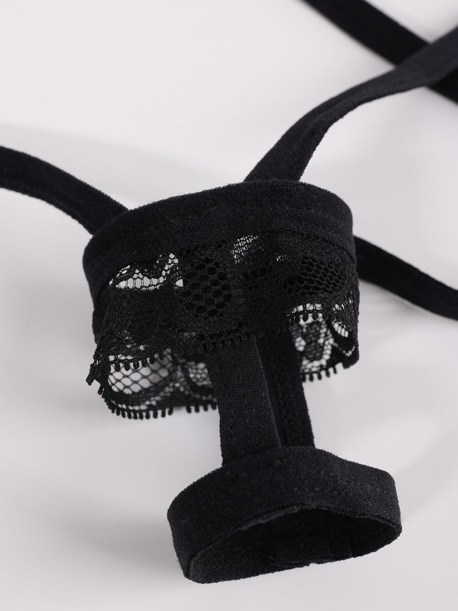 Men's low rise black thong underwear with lace patchwork trim