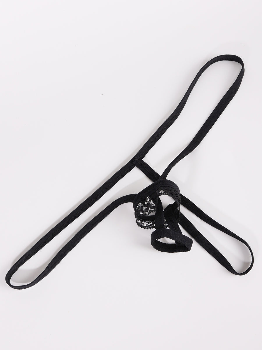 Men's low rise black thong underwear with lace patchwork trim