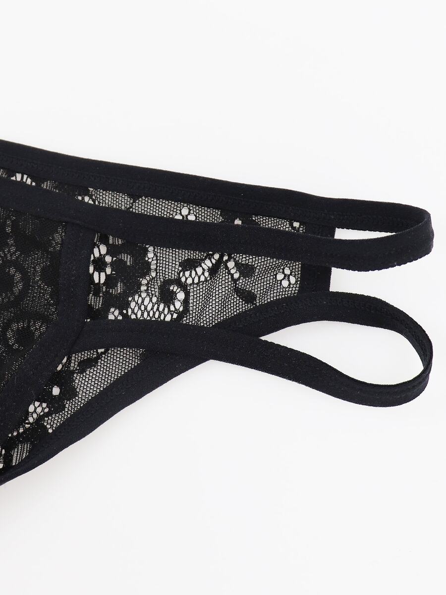 Black low rise men's mesh jockstrap brief featuring lace hollow back waist detail.