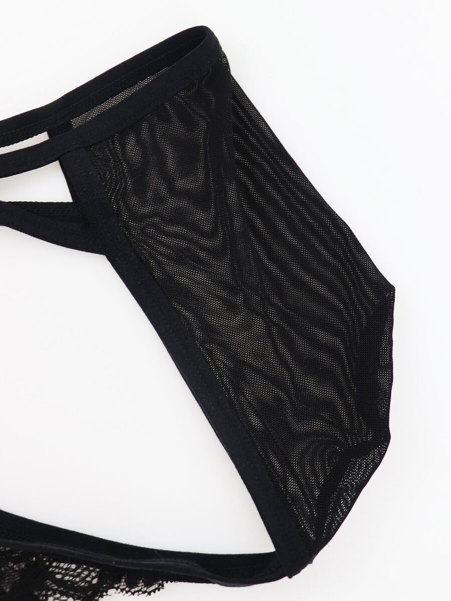 Black low rise men's mesh jockstrap brief featuring lace hollow back waist detail.
