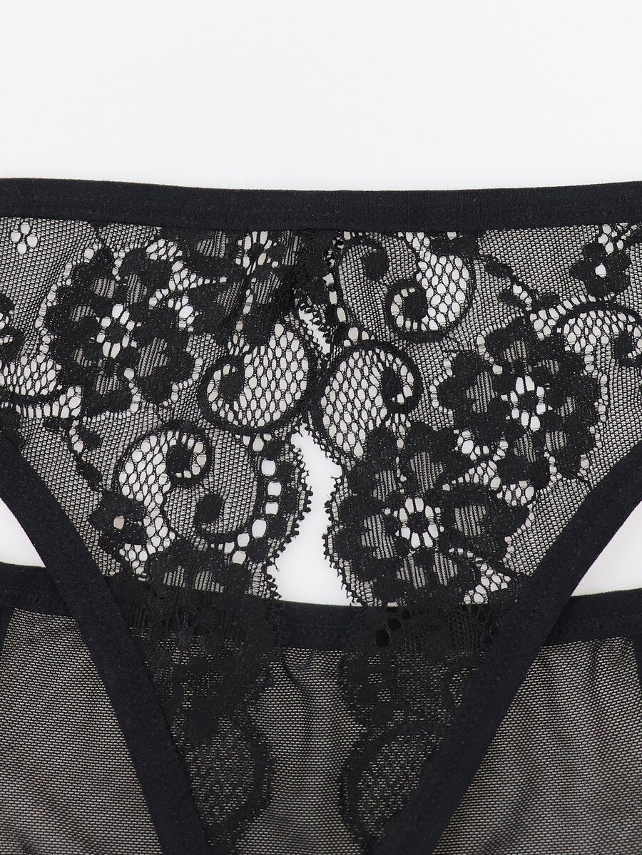 Black low rise men's mesh jockstrap brief featuring lace hollow back waist detail.