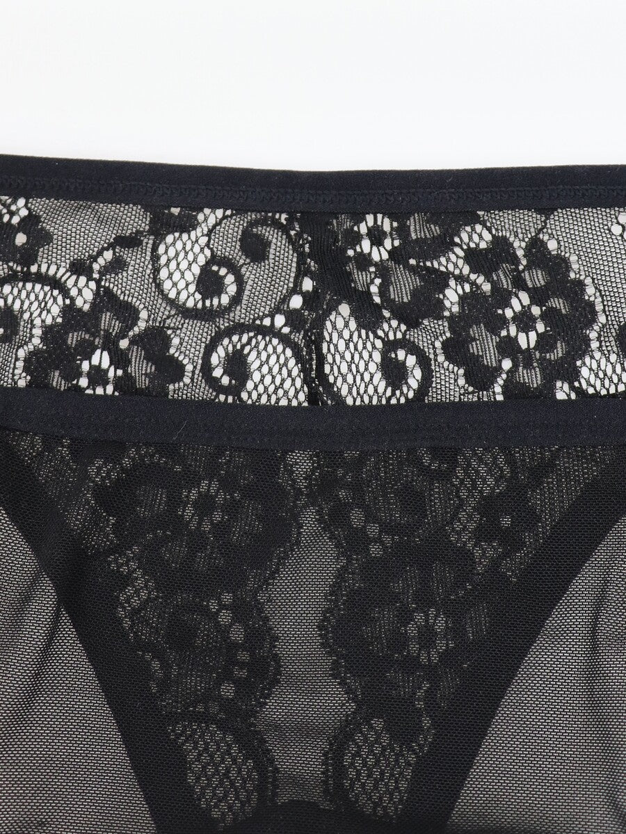 Black low rise men's mesh jockstrap brief featuring lace hollow back waist detail.