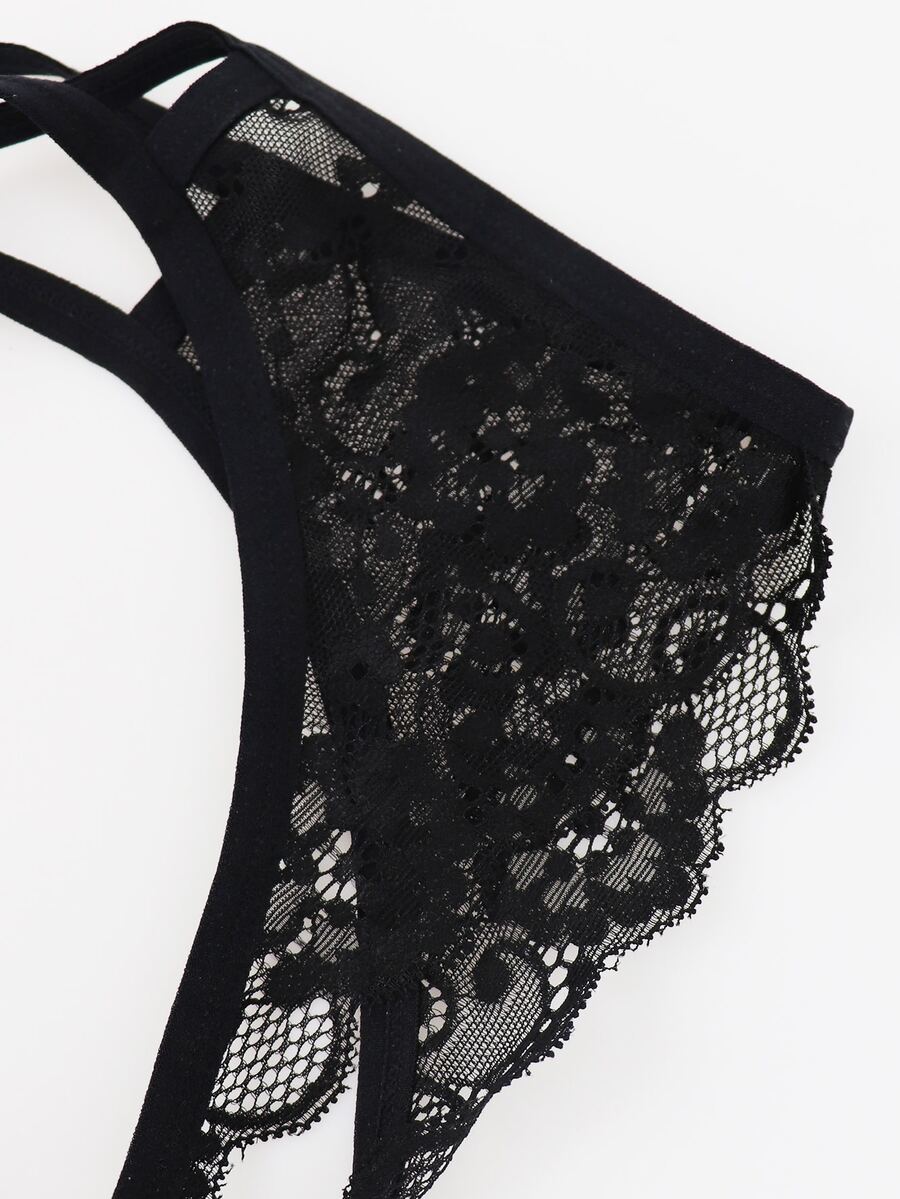 Black low rise men's mesh jockstrap brief featuring lace hollow back waist detail.