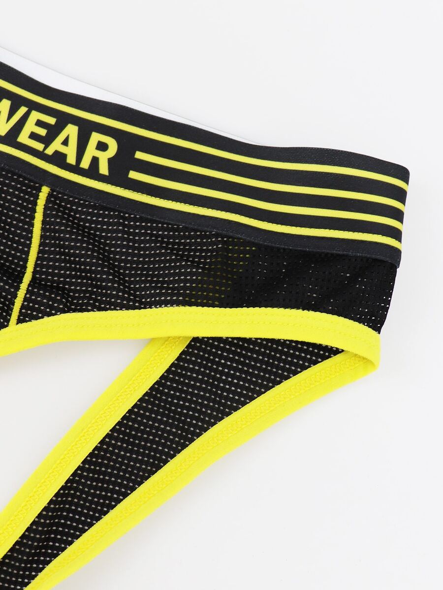 Black mid-rise men's jockstrap underwear featuring bold yellow trim and patterned waistband.